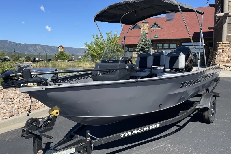 Slide: The Image of 2027 Tracker Pro Guide V-16 SC boat with Minn Kota motor on trailer. - 36