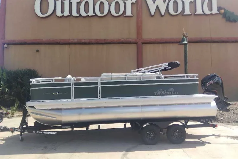 The Image of 2027 Sun Tracker Fishin' Barge 20 DLX pontoon boat displayed at Outdoor World. - 0