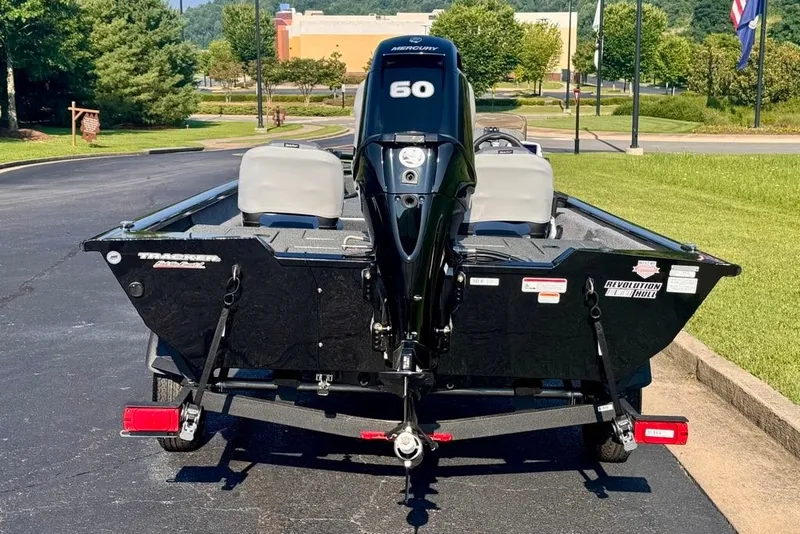 Slide: The Image of 2027 Tracker Pro Team 175 Crappie Edition boat with Mercury 60 engine, parked outdoors. - 18
