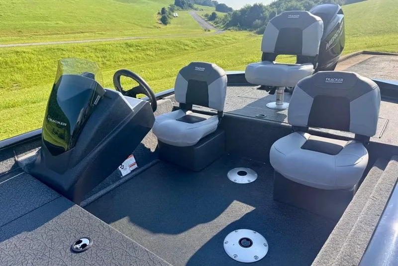Slide: The Image of 2027 Tracker Pro Team 175 Crappie Edition boat interior with seating and steering console. - 14