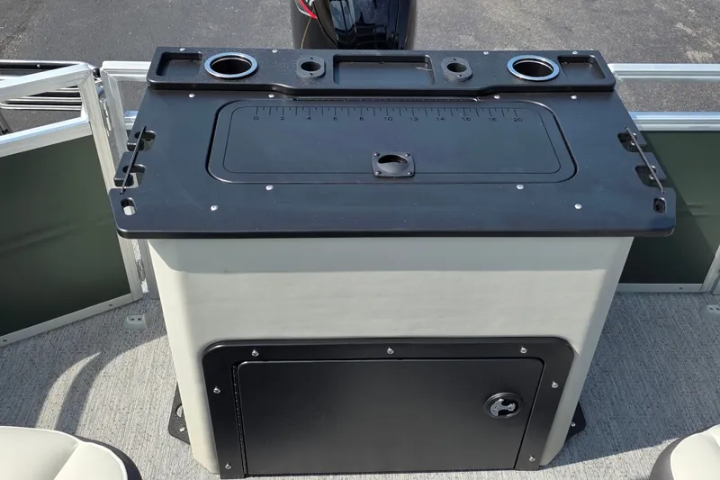 Slide: The Image of 2027 Sun Tracker Fishin' Barge 20 DLX fishing station with cup holders and storage compartment. - 26