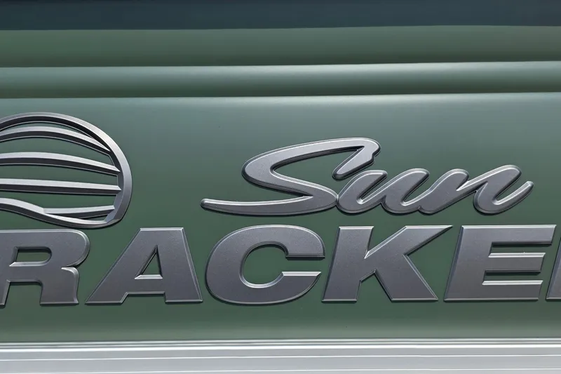Slide: The Image of Sun Tracker Fishin' Barge 20 DLX 2027 logo on green background. - 16