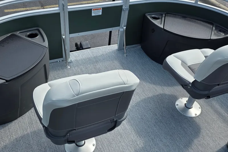 Slide: The Image of 2027 Sun Tracker Fishin' Barge 20 DLX interior with seating and storage compartments. - 28