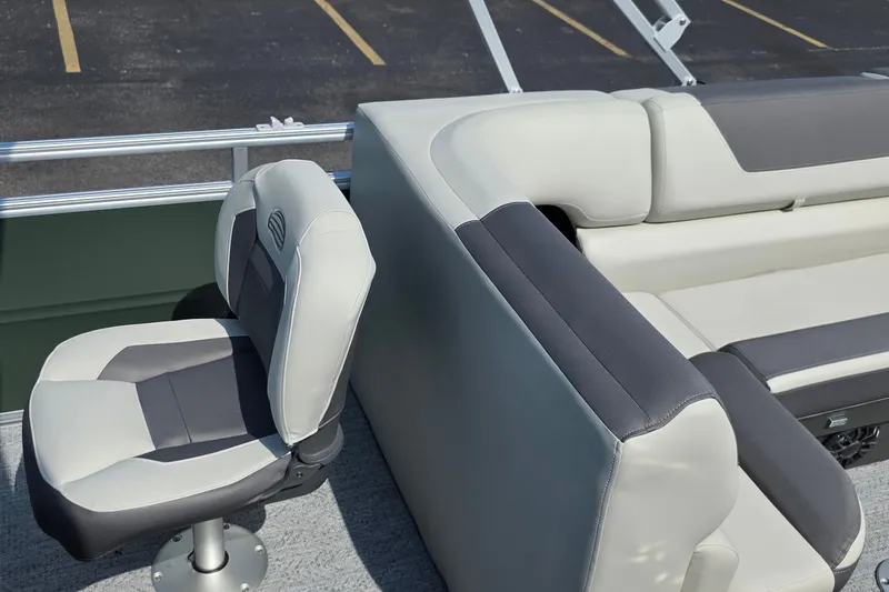 Slide: The Image of 2027 Sun Tracker Fishin' Barge 20 DLX boat seating, featuring comfortable gray and black upholstery. - 33
