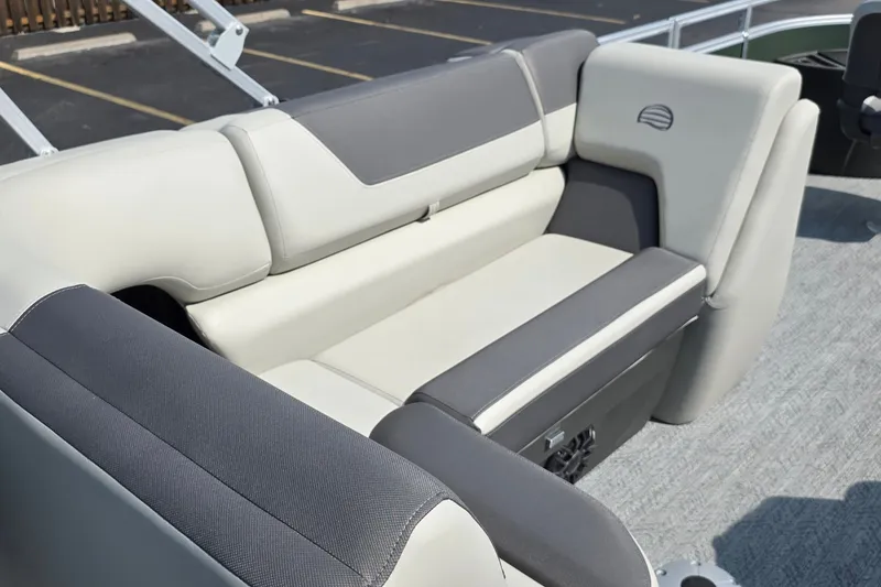 Slide: The Image of 2027 Sun Tracker Fishin' Barge 20 DLX boat seating, featuring gray and cream upholstery. - 31