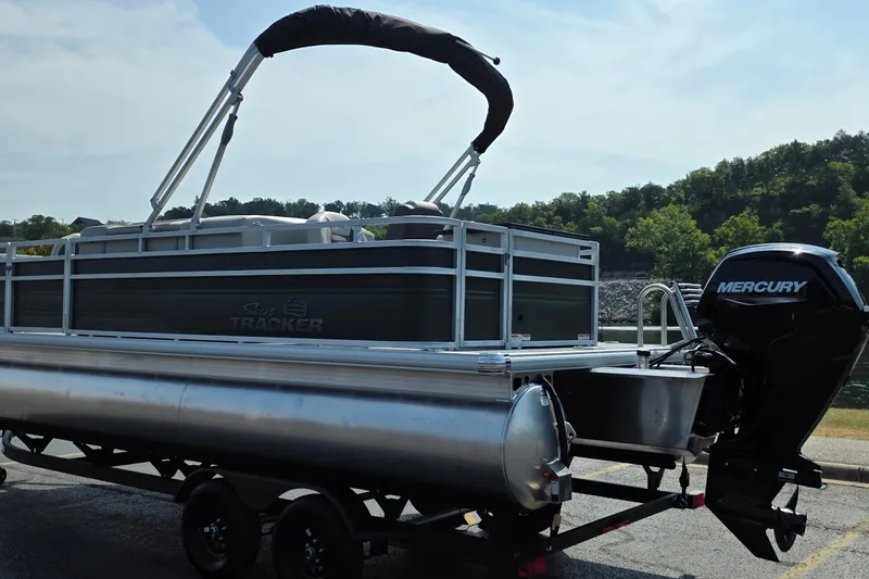 Slide: The Image of 2027 Sun Tracker Fishin' Barge 20 DLX pontoon boat with Mercury engine on trailer. - 15