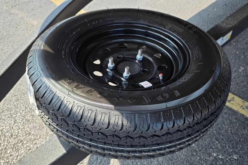 Slide: The Image of Spare tire for 2027 Sun Tracker Fishin' Barge 20 DLX on a trailer. - 19