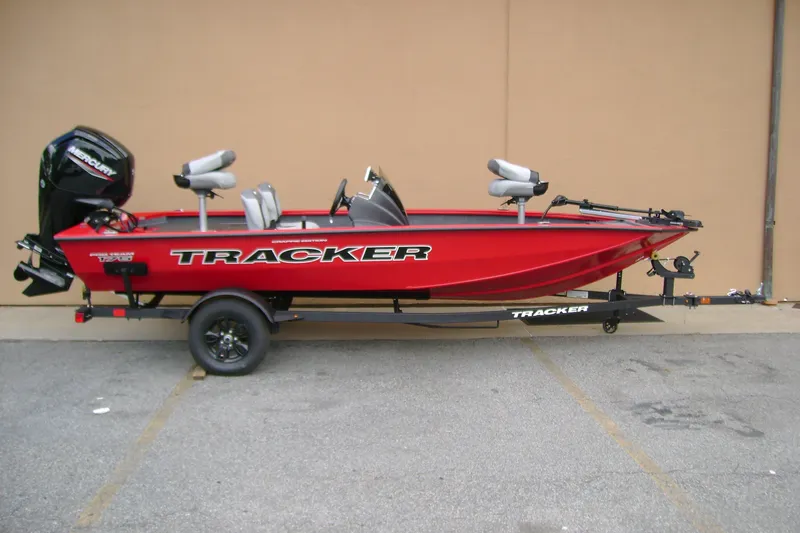 The Image of 2027 Tracker Pro Team 175 Crappie Edition boat on trailer, red with Mercury engine. - 0