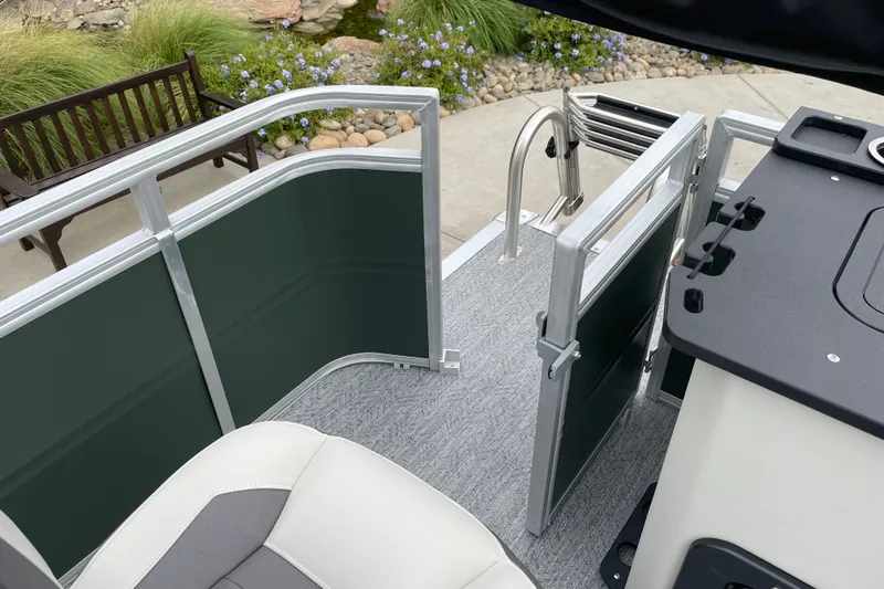 Slide: The Image of 2027 Sun Tracker Fishin' Barge 20 DLX interior with seating and railing details. - 25