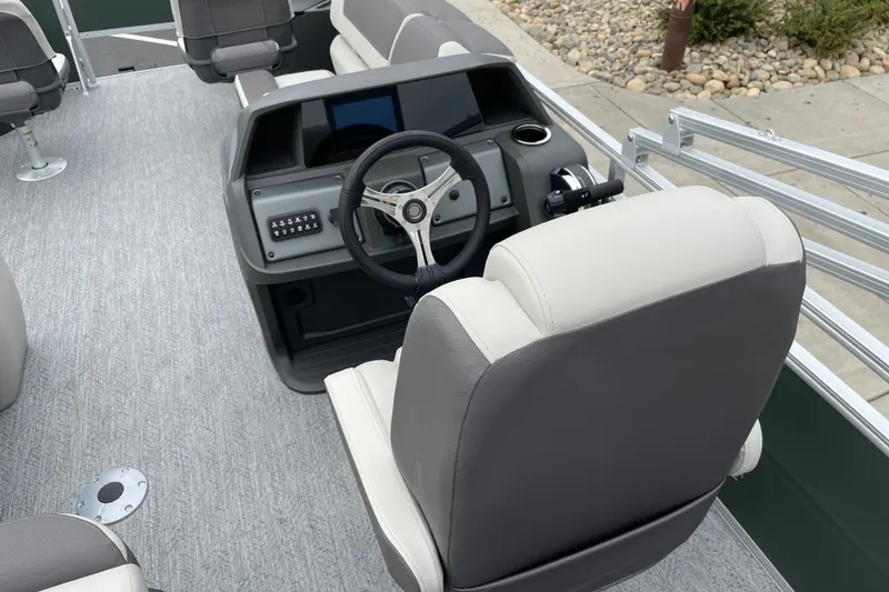 Slide: The Image of 2027 Sun Tracker Fishin' Barge 20 DLX helm with steering wheel and seating. - 13