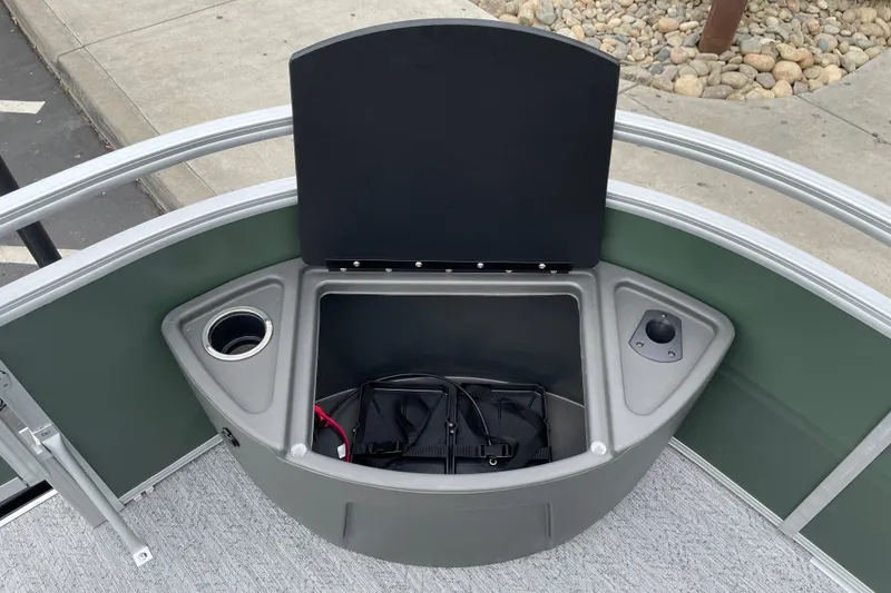 Slide: The Image of 2027 Sun Tracker Fishin' Barge 20 DLX storage compartment with cup holder and utility space. - 16