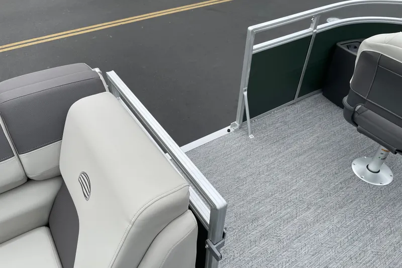Slide: The Image of 2027 Sun Tracker Fishin' Barge 20 DLX interior with gray seating and carpeted flooring. - 27