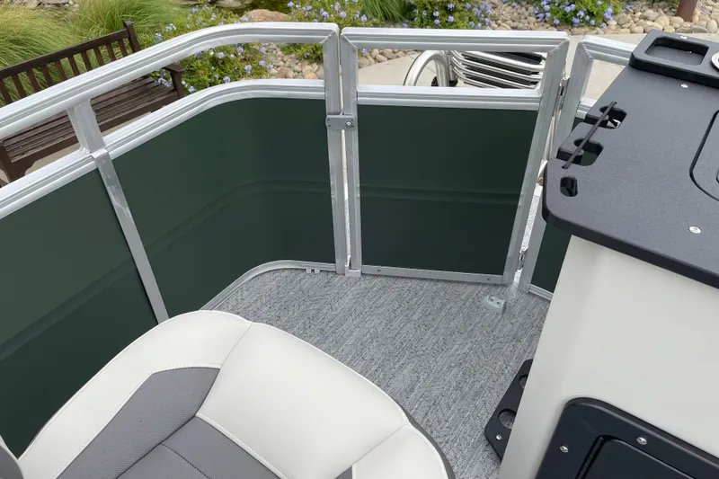 Slide: The Image of 2027 Sun Tracker Fishin' Barge 20 DLX interior with seating and railing details. - 24