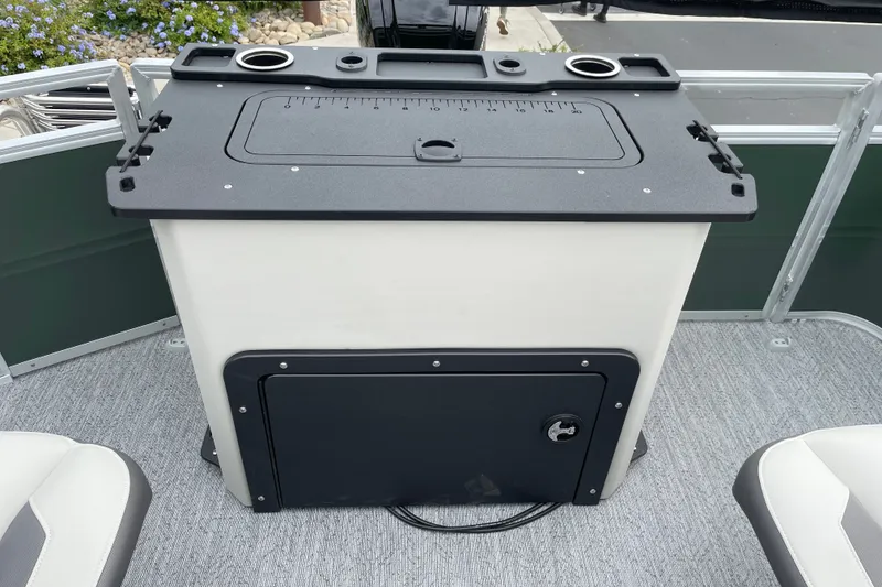 Slide: The Image of 2027 Sun Tracker Fishin' Barge 20 DLX fishing station with storage and cup holders. - 19