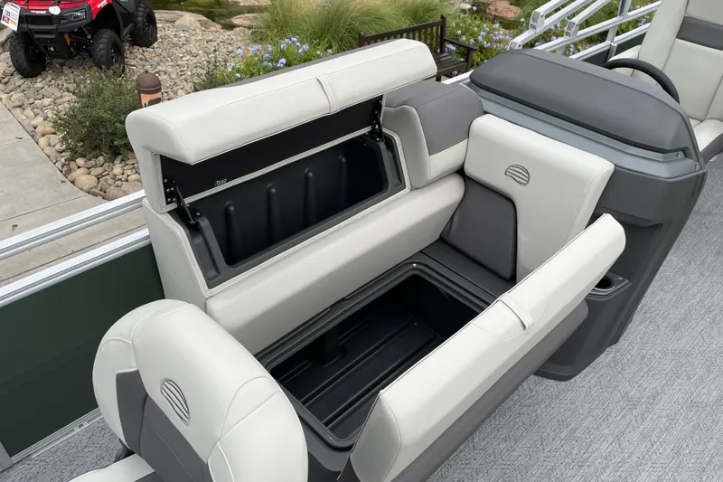 Slide: The Image of 2027 Sun Tracker Fishin' Barge 20 DLX boat interior with open storage compartments. - 17