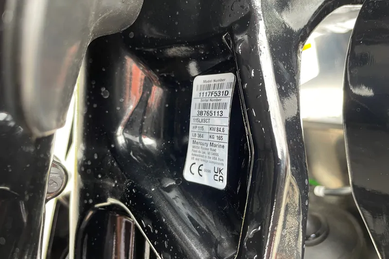 Slide: The Image of Close-up of a 2027 Sun Tracker Fishin' Barge 20 DLX model number label. - 84
