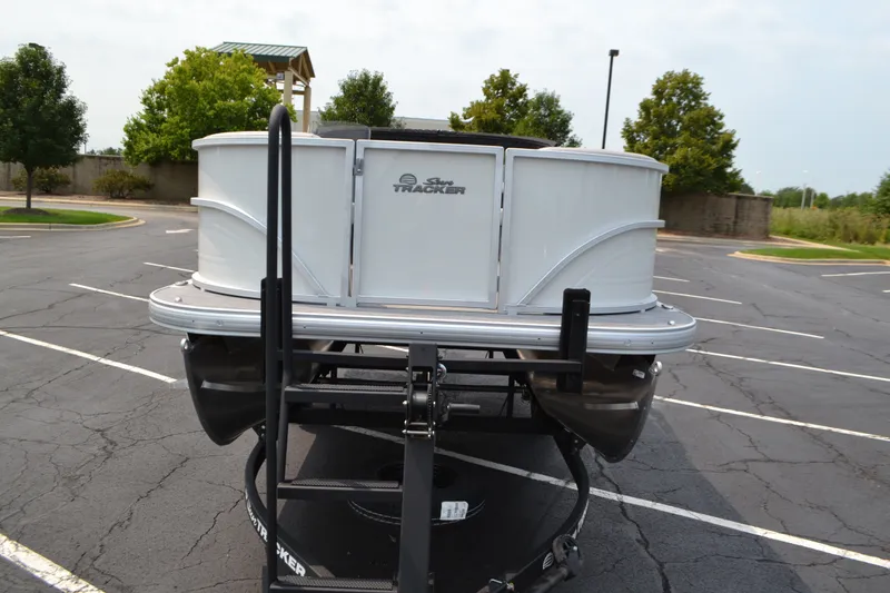 Slide: The Image of 2027 Sun Tracker Party Barge 16 DLX on trailer in parking lot. - 68