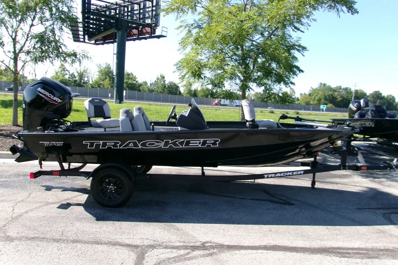 The Image of 2027 Tracker Pro Team 175 boat on trailer, parked outdoors. - 0