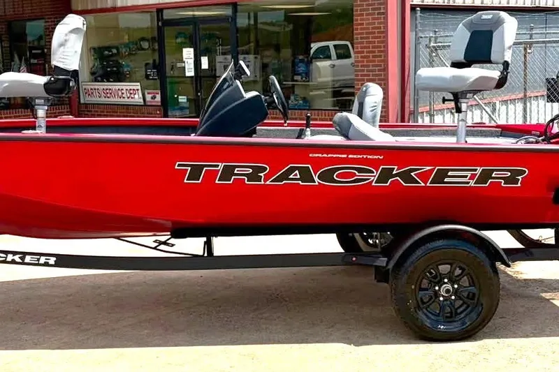The Image of 2027 Tracker Pro Team 175 Crappie Edition boat, red, parked outside service department. - 0