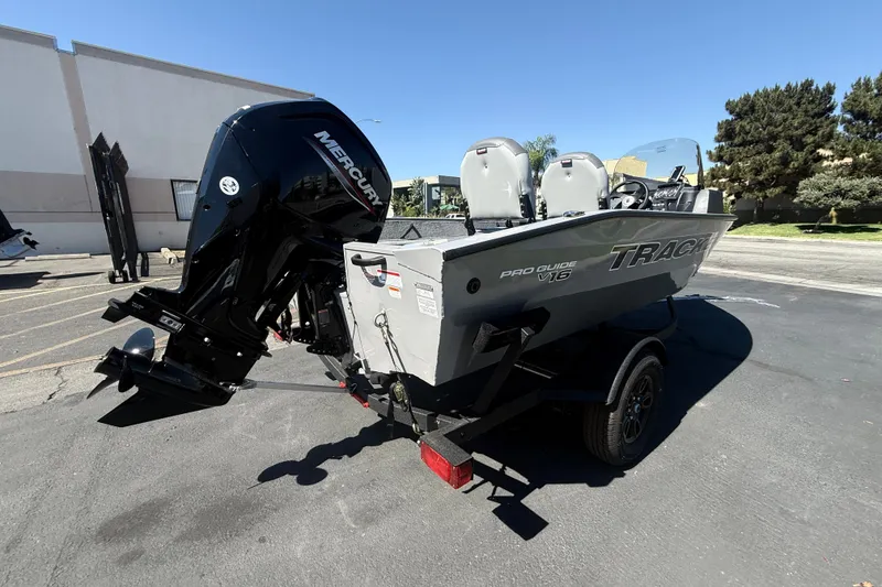 Slide: The Image of 2027 Tracker Pro Guide V-16 SC boat with Mercury engine on a trailer. - 14