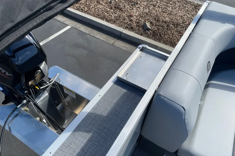 Slide: The Image of 2027 Sun Tracker Party Barge 16 DLX pontoon boat with motor and seating detail. - 14