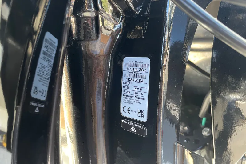 Slide: The Image of Close-up of Sun Tracker Party Barge 16 DLX 2027 model serial number label. - 82