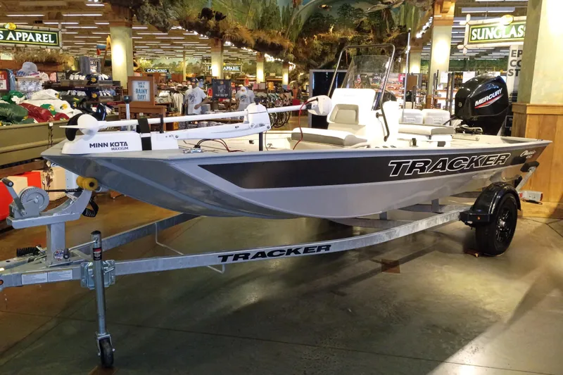 The Image of 2027 Tracker Bass Tracker Classic CC boat displayed indoors on a trailer. - 0