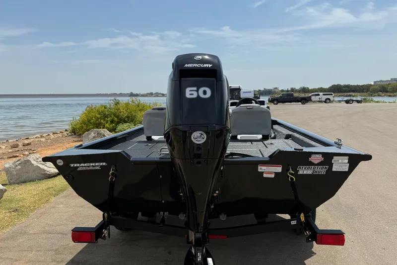 Slide: The Image of 2027 Tracker Pro Team 175 Crappie Edition boat with Mercury 60 engine by a lakeside. - 14