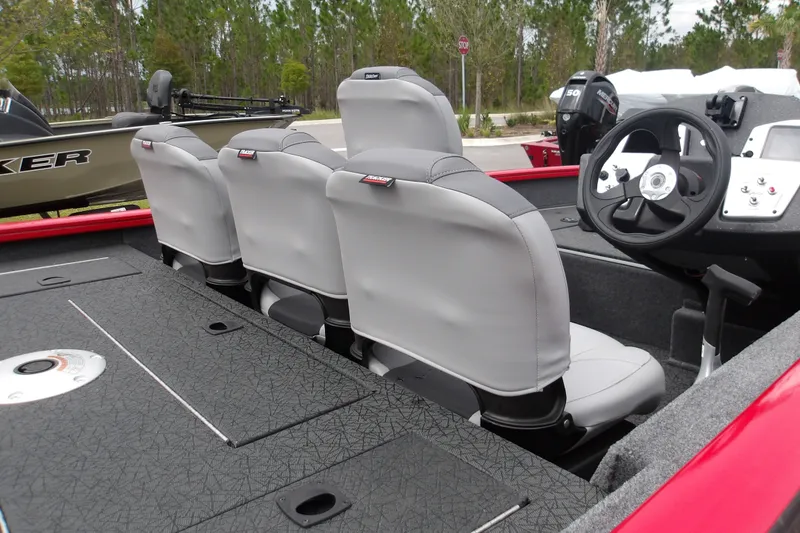 Slide: The Image of 2027 Tracker Pro Team 175 Crappie Edition boat interior with three seats and steering wheel. - 14