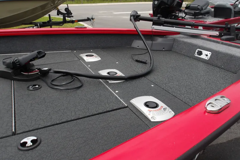 Slide: The Image of 2027 Tracker Pro Team 175 Crappie Edition boat deck with fishing rod holders. - 18