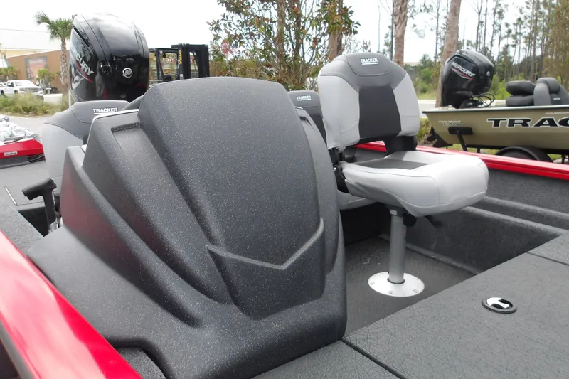 Slide: The Image of 2027 Tracker Pro Team 175 Crappie Edition boat interior with seating and motor. - 17