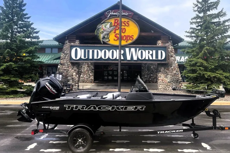 The Image of 2027 Tracker Pro Guide V-16 SC boat displayed outside Bass Pro Shops Outdoor World. - 0