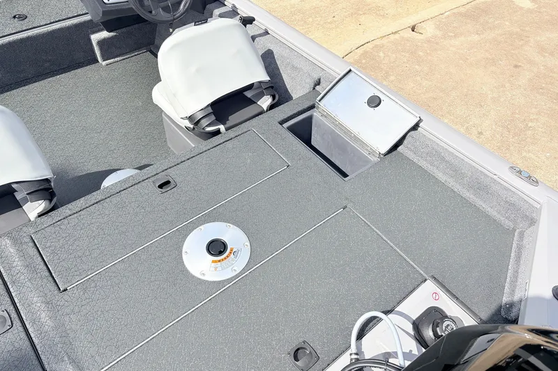 Slide: The Image of 2027 Tracker Pro Team 175 Crappie Edition boat interior with seating and storage compartments. - 35