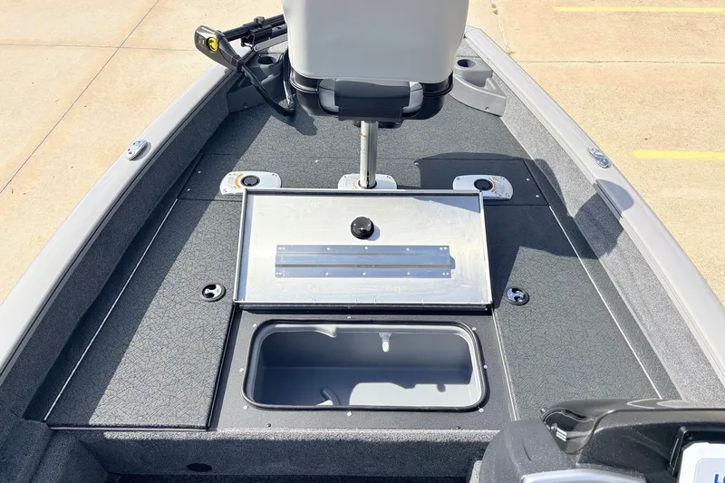 Slide: The Image of 2027 Tracker Pro Team 175 Crappie Edition boat interior with fishing seat and storage compartments. - 18