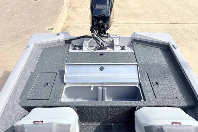 Slide: The Image of 2027 Tracker Pro Team 175 Crappie Edition boat interior with storage compartments and motor. - 29