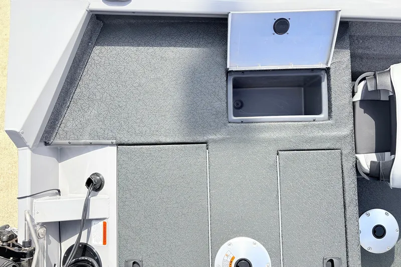 Slide: The Image of 2027 Tracker Pro Team 175 Crappie Edition boat interior with storage compartments and seating. - 33