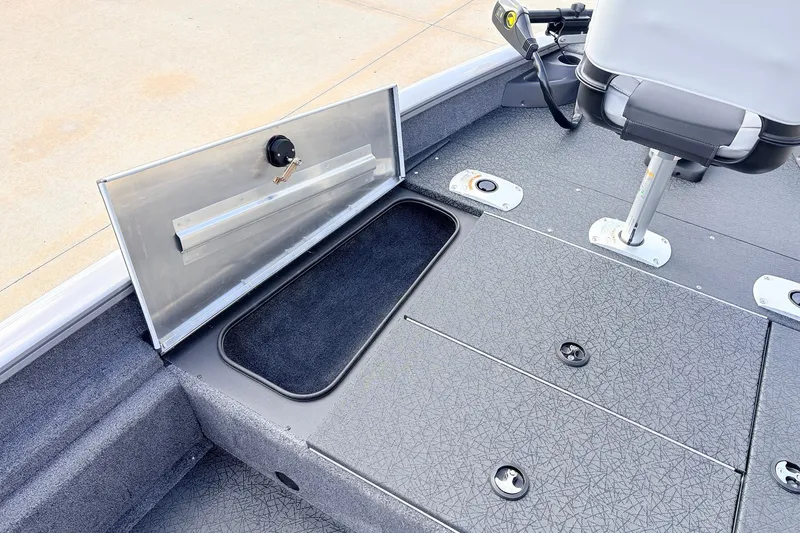 Slide: The Image of 2027 Tracker Pro Team 175 Crappie Edition boat interior with storage compartment open. - 13