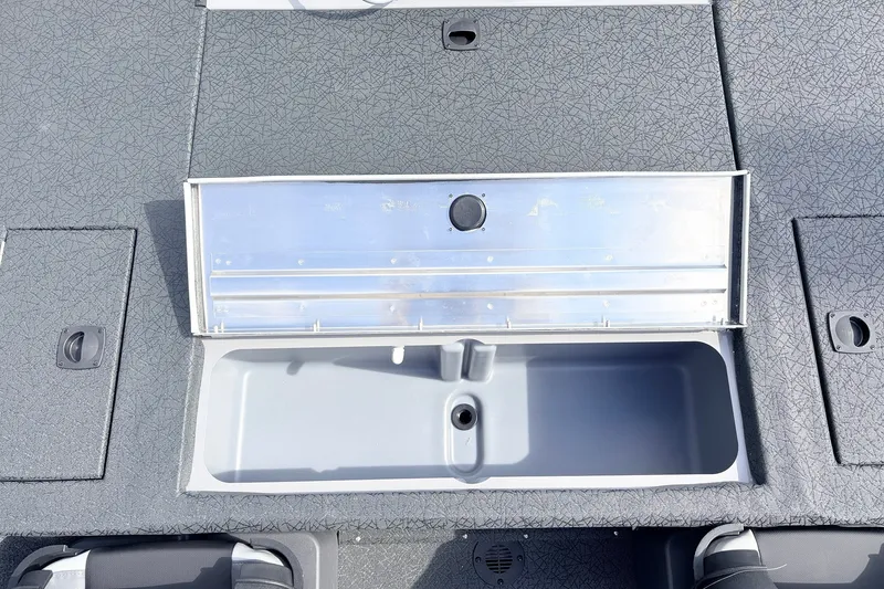 Slide: The Image of 2027 Tracker Pro Team 175 Crappie Edition boat storage compartment with open lid. - 30