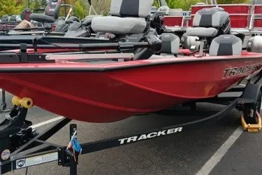 The Image of 2027 Tracker Pro Team 175 Crappie Edition boat, red exterior, parked on trailer. - 0