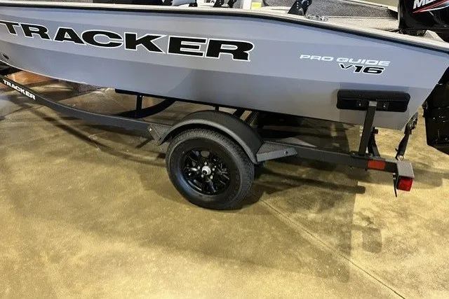 The Image of 2027 Tracker Pro Guide V-16 SC boat on trailer, side view. - 0