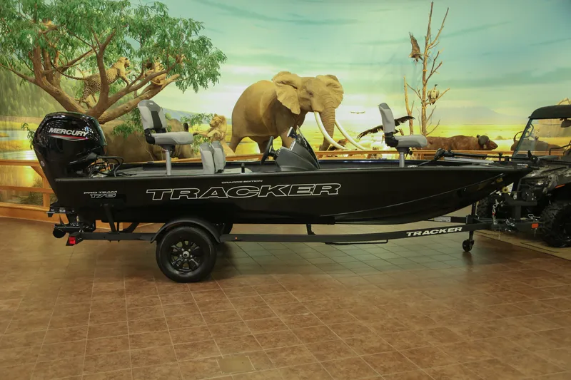 The Image of 2027 Tracker Pro Team 175 Crappie Edition boat displayed indoors with wildlife backdrop. - 0