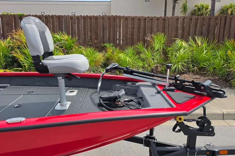 Slide: The Image of Red 2027 Tracker Pro Team 175 Crappie Edition boat with fishing seat and trolling motor. - 15