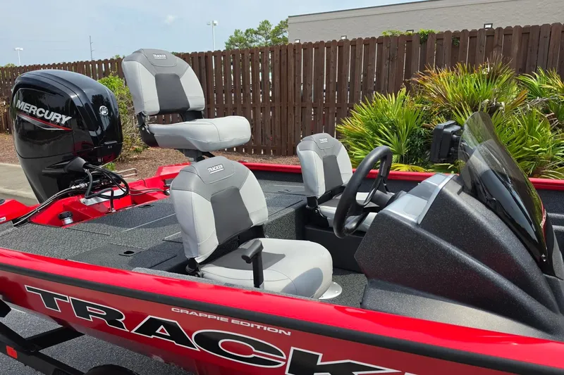 Slide: The Image of 2027 Tracker Pro Team 175 Crappie Edition boat with Mercury engine, red and gray interior. - 14
