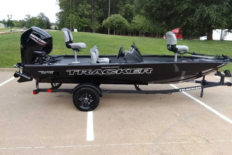 The Image of 2027 Tracker Pro Team 175 Crappie Edition boat on trailer in parking lot. - 0