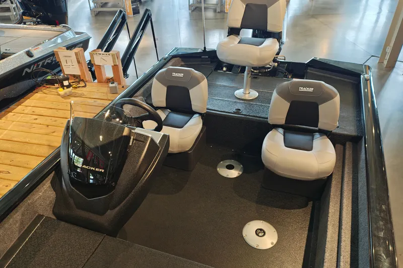 Slide: The Image of 2027 Tracker Pro Team 175 Crappie Edition boat interior with seating and steering console. - 26