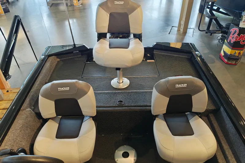 Slide: The Image of 2027 Tracker Pro Team 175 Crappie Edition boat interior with three cushioned seats. - 27