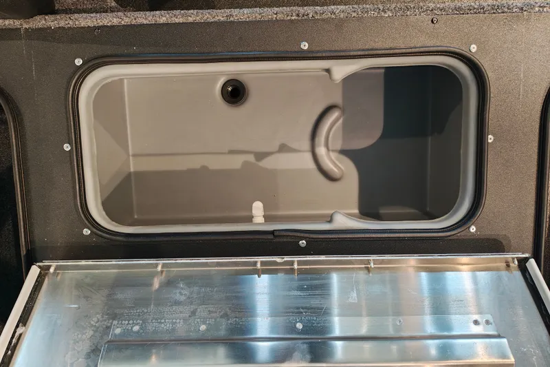 Slide: The Image of Storage compartment of 2027 Tracker Pro Team 175 Crappie Edition boat, open and empty. - 20