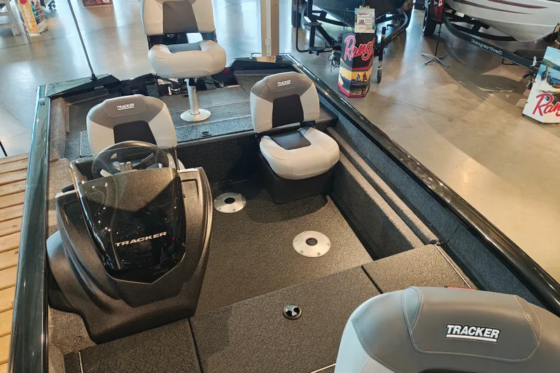 Slide: The Image of 2027 Tracker Pro Team 175 Crappie Edition boat interior with seating and steering console. - 25