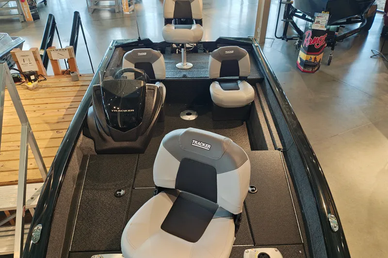 Slide: The Image of 2027 Tracker Pro Team 175 Crappie Edition boat interior with seating and console. - 24