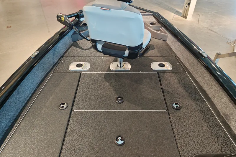 Slide: The Image of 2027 Tracker Pro Team 175 Crappie Edition boat interior with seating and storage compartments. - 18